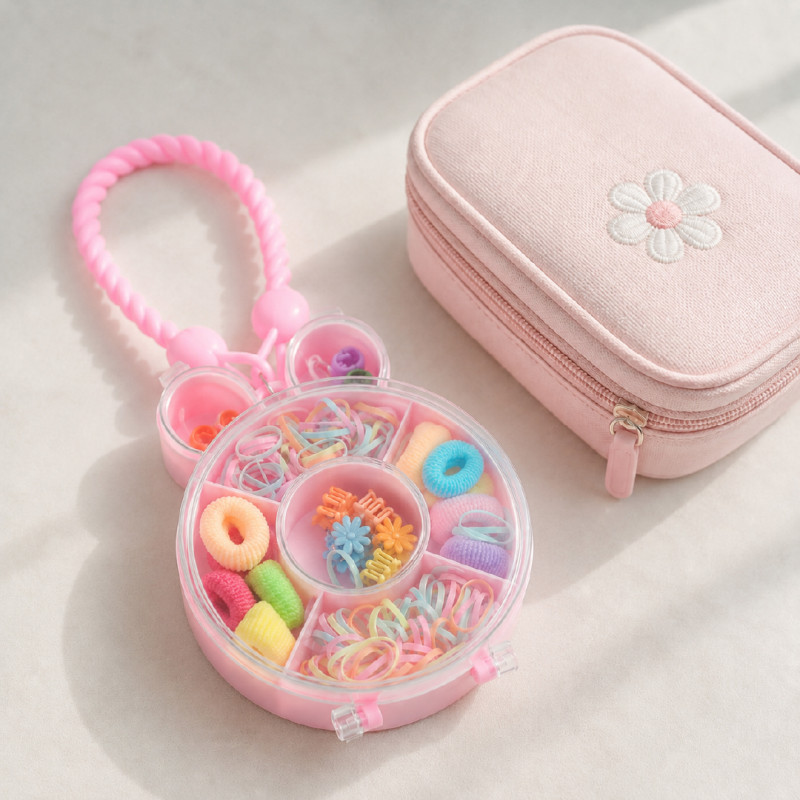 Nostalgic bunny-shaped kid's hair accessory storage box from Blingspot featuring colorful rubber bands, mini scrunchies, and flower clips – RGB (22 x 10 cm)